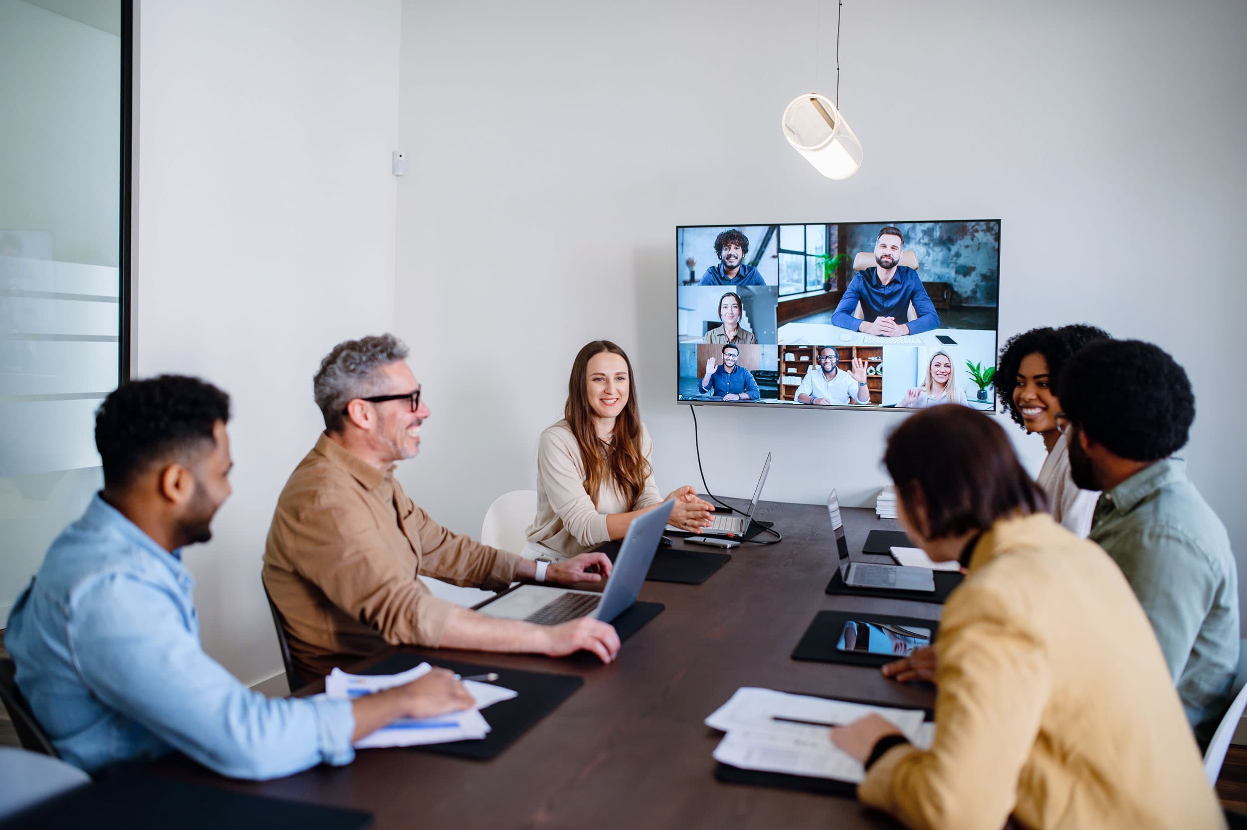 The future of work through hybrid models, highlighting their impact on employee satisfaction and business growth